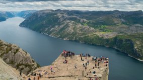 Video with a view on famous Preikestolen, with many people in the scene