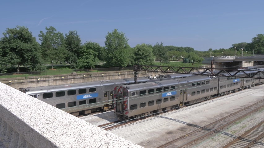 Train arriving and Grant Park in background from Michigan Avenue, Chicago, Illinois, United States of America, North America