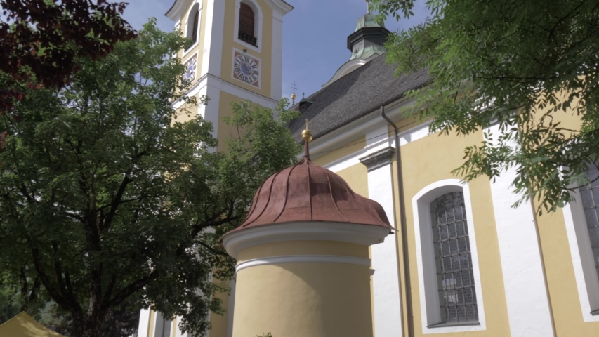 The colourful church in the town of St. Johann, Austrian Alps, Tyrol, Austria, Europe
