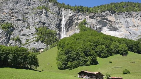 Spiez, Switzerland - June 17, 2019: Landscape in the Lauterbrunnen Valley with  the Staubbach Falls in Lauterbrunnen in the Bernese Oberland of Switzerland