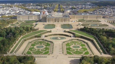French castle, Palace of Versailles (Chateau de Versailles), drone aerial view with landscaped gardens & the surrounding area