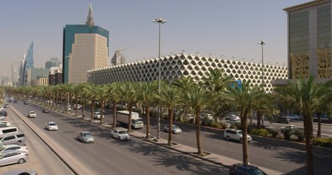 cars  passing slow motion Riyadh Saudi Arabia 4K Stock Video Footage .Traffic drives over a busy King Fahd Road Riyadh, Saudi Arabia 