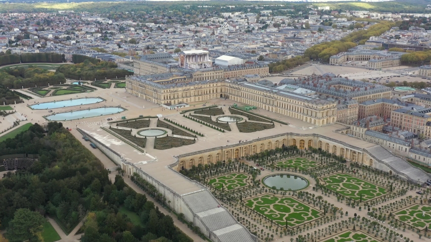 French castle, Palace of Versailles (Chateau de Versailles), drone aerial view with landscaped gardens & orangery