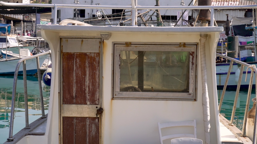  The old yacht is moored in the port