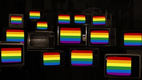 The Rainbow Flag, commonly known as the Gay Pride Flag or LGBTQ Pride Flag, on Retro Tvs. Sepia Tone. Zoom In. Stockvideo