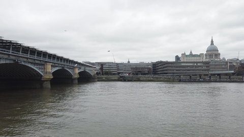 London, UK - 2019: view of the Thames and Blackfriars Railway Bridge, autumn in London, it's raining.