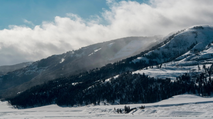 Time lapse in early morning light of clouds passing over mountain in Lamar Valley, Yellowstone N.P.