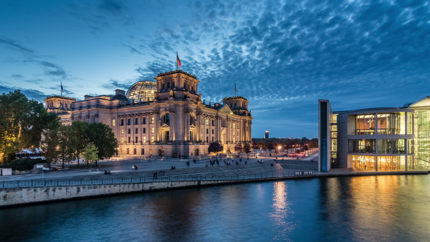 BERLIN, GERMANY - OCTOBER 20, 2019: Timelapse view of famous Reichstag building (german government) at evening, Berlin, Germany.