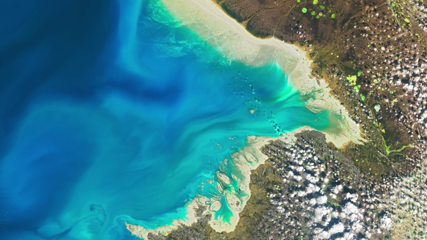 Aerial satellite scenic view of Dewey Soper Bird Sanctuary in Canada, island coastline blue sea and green natural landscape. Contains public domain image by Nasa
