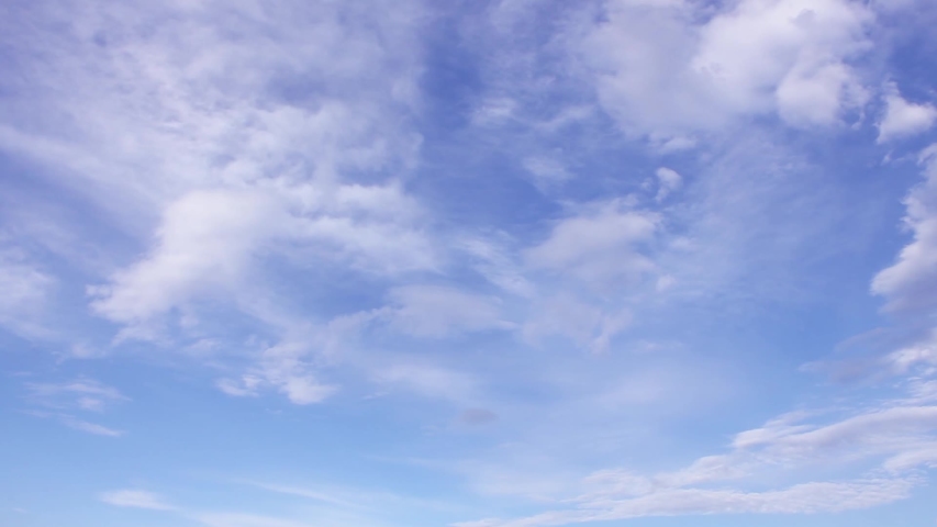 A peaceful time-lapse showing clouds transitioning slowly across a vibrant blue sky, capturing the calm beauty of the weather and the gradual change in cloud formations throughout the day. FHD.