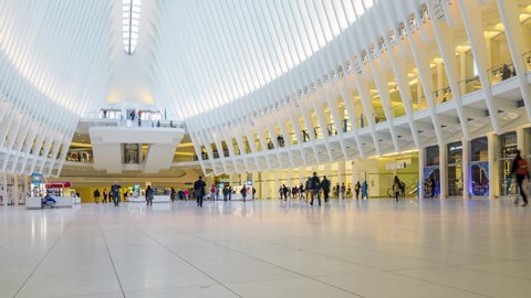 NEW YORK CITY, USA - April 1,2019 : Time Lapse people walking on white floor or large crownd of anomymous in transportation hub in modern hall center in urban city at Path train to New Jersey station