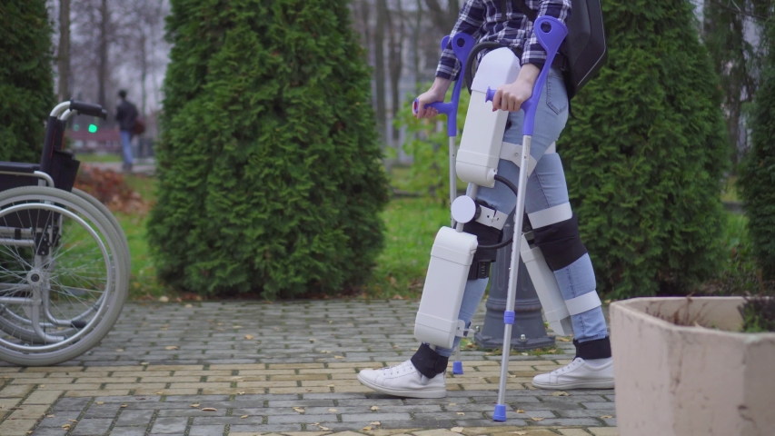 paralyzed man learns to walk again with robotic exoskeleton Royalty-Free Stock Footage #1039693043