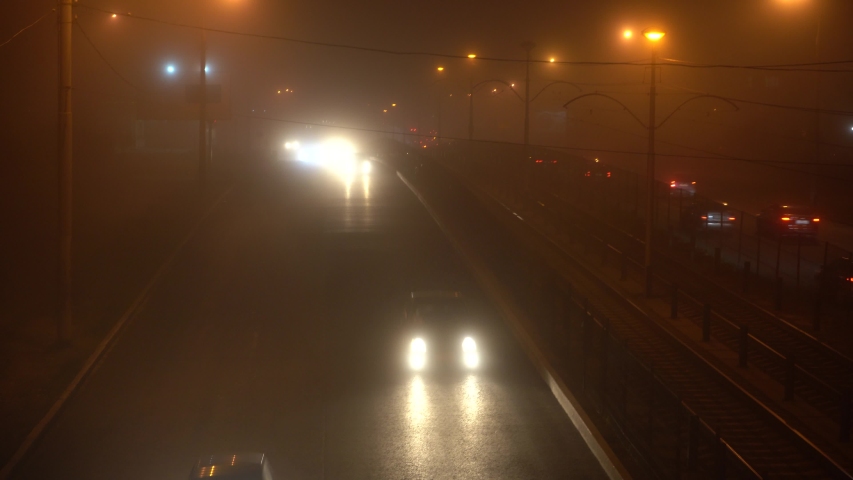 Weather. Heavy fog. Cars move in heavy fog. Night car traffic. | Shutterstock HD Video #1039694282