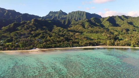 Stunning aerial footage of the Rarotonga island with clear lagoon and jungle covered mountain in the Cook island in south Pacific
