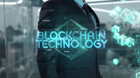 Businessman with Blockchain Technology hologram concept