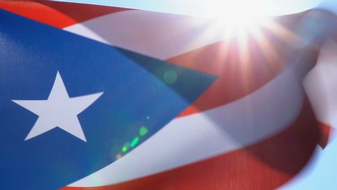 Puerto Rican Flag Flapping on Blue Sky Background