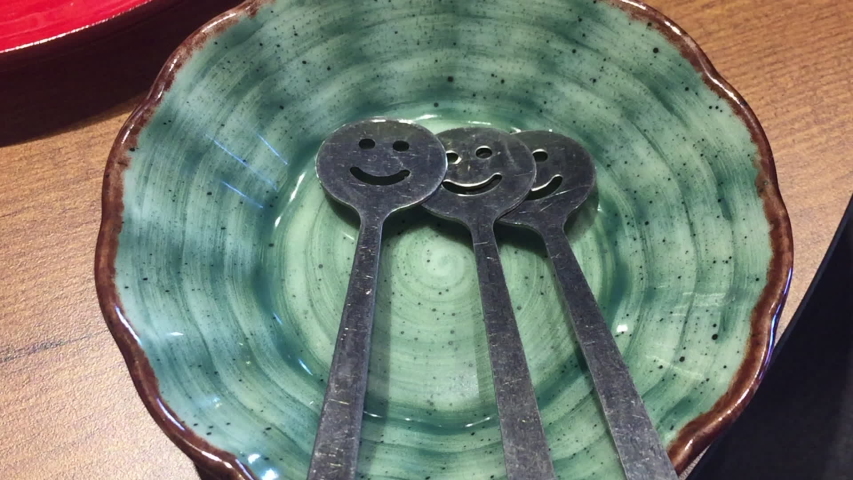Benthree happy spoons in blue plate