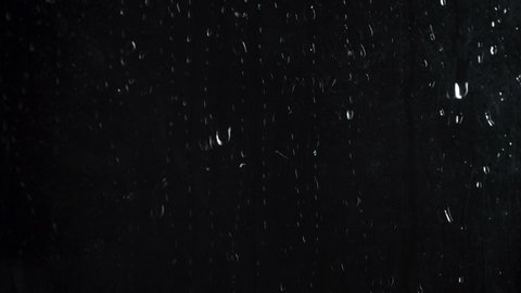 Shooting of rain drops on black background