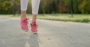 Handheld view of woman’s legs starting up her jogging training