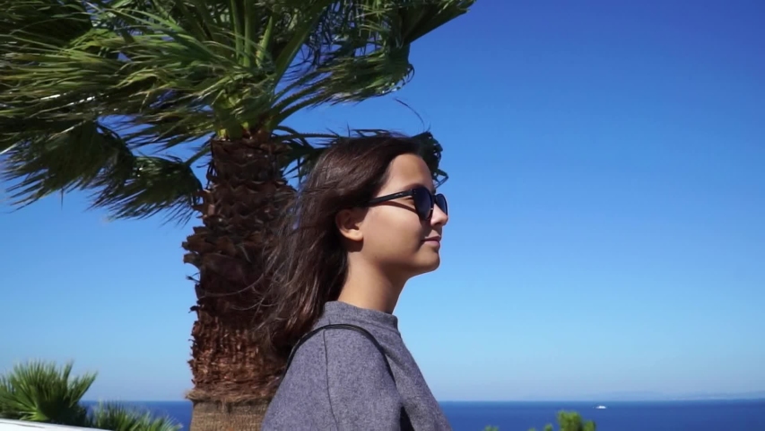 A young girl looks at the sea, Kusadasi, Turkey,
