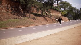 free running young man practicing parkour in the road makes different tricks wide shoot in slow motion - Powered by Shutterstock - Get 15% off with code: PIKWIZARD15