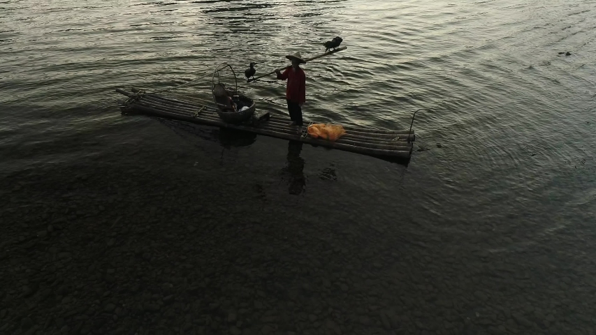 Chinese traditional fisherman with cormorants fishing, Li River