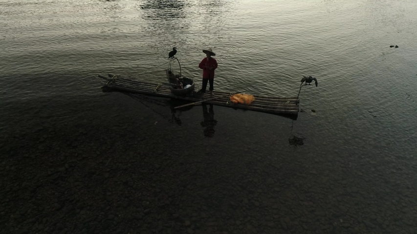 Chinese traditional fisherman with cormorants fishing, Li River