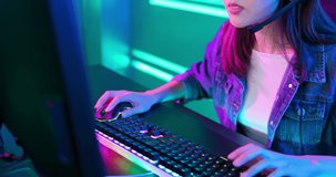 close up of pro cyber sport gamer play game with RGB keyboard and mouse