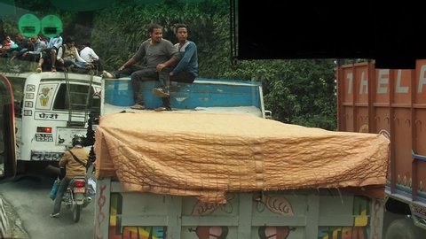 Kathmandu / Nepal - 08 31 2019: People on Bus and Truck Roof, Chaotic Daily Road Traffic