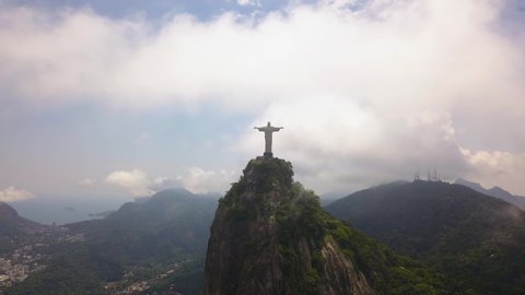 Rio De Janeiro / Brazil - 08 31 2019: Pull Back Aerial of Christ The Redemeer aka Cristo Redentor, Statue of Jesus in The Clouds