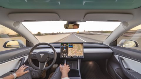 Irvine, CA / USA - 10/25/2019: Interior view of Tesla Model 3 autonomous car or EV in full self driving autopilot mode showing the advanced innovation of future electric cars.