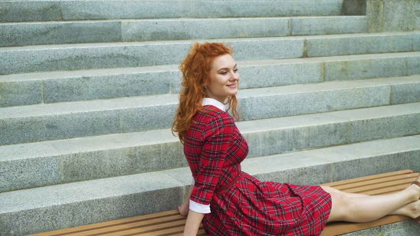 Pretty girl relaxing in urban environment