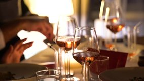 Wine Glasses at Restaurant People Having Dinner High Quality Slow Motion Video Rose and Red Wine Warm Atmosphere Lunch Stock Footage