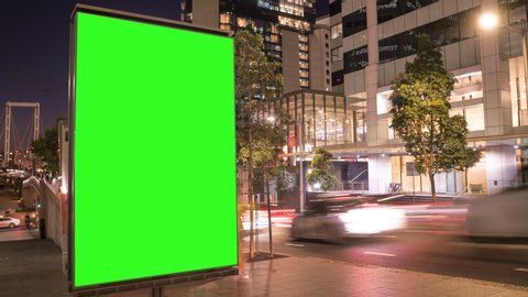 City street Billboard stand with green screen. Time lapse with commuters, people and cars. Space for text or copy.
