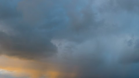 Storm clouds in sky during storm in time lapse as it moves over ocean. Epic storm tropical clouds at sunset. Coast of the Pacific Ocean. Beautiful clouds and sky after sunset 4K UHD Timelapse.