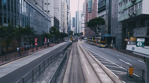 Hong Kong China, 9 July 2019: 4K Time lapse or hyper lapse of Tram moving along busy street in Hong Kong at day time. Transportation, technology, economic or business concept.