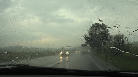 Traffic in Rain in City, Driving Car, Heavy Storm on Road, Highway, Rainy Drops