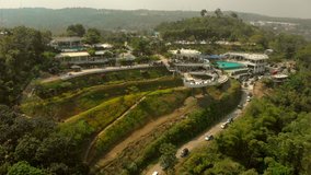Aerial footage of Eling Bening tourist destination in Central Java, Indonesia with orbital maneuver drone camera