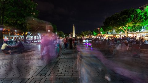 Istanbul, Turkey - July 16, 2014 : People celebrating Ramadan at Sultanahmet Square, Istanbul, Turkey time lapse at night