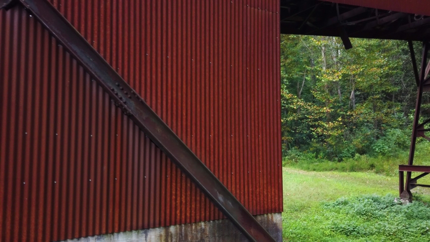 Camera pitching up and panning right to reveal the Nuttallburg coal tipple and conveyor at New River Gorge National Park.