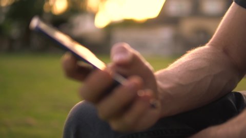 Cinematic Close Up Of Man Using Tablet Touchscreen Outside.