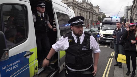 London / United Kingdom (UK) - 09 09 2019: Police vans pull up and officers get out