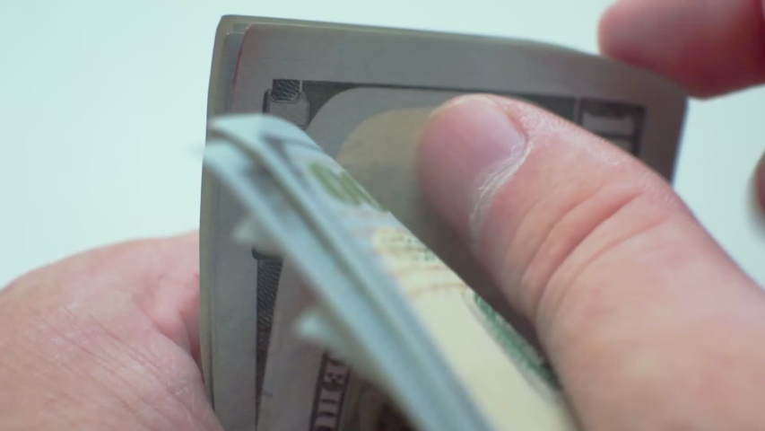 Money recount.business concept
fingers sorting paper hundred dollar bills.close-up. | Shutterstock HD Video #1039848503