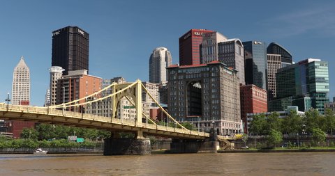 Pittsburgh, Pennsylvania - June 23 2019: City skyline view over the Allegheny River and Roberto Clemente Bridge in downtown Pittsburgh Pennsylvania USA