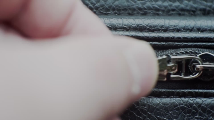 zipper on  leather product. closeup.great screensaver for your design