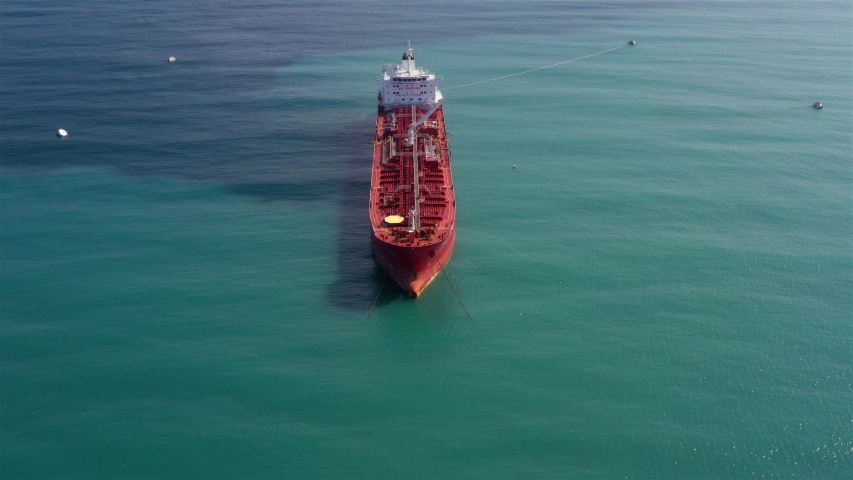 Oil spills out of a ship to Mediterranean Sea- Aerial View
Drone view of oil Chemical Tanker Tied with strings Spills oil in the sea
 | Shutterstock HD Video #1039851707