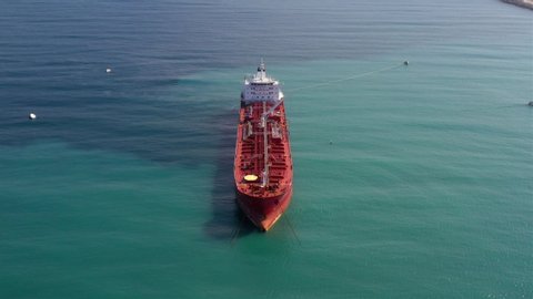 Oil spills out of a ship to Mediterranean Sea- Aerial View
Drone view of oil Chemical Tanker Tied with strings Spills oil in the sea
