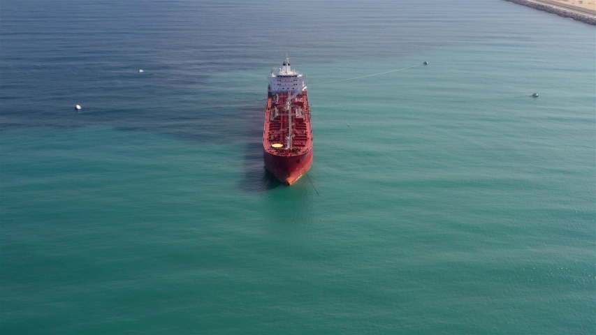 Oil spills out of a ship to Mediterranean Sea- Aerial View
Drone view of oil Chemical Tanker Tied with strings Spills oil in the sea
 | Shutterstock HD Video #1039851716