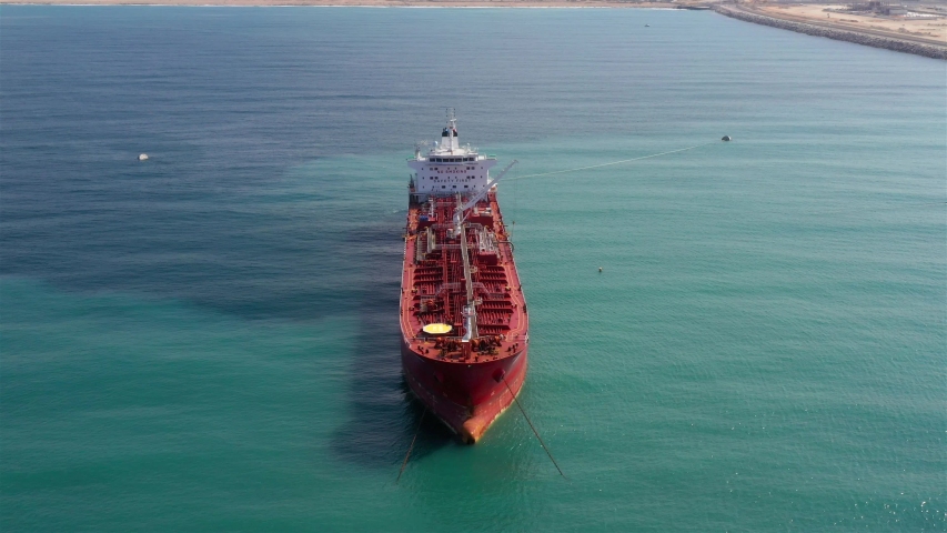 Chemical Tanker spills oil to Sea- Aerial View
Drone view of oil Chemical Tanker Tied with strings Spills oil in the sea
 | Shutterstock HD Video #1039851728