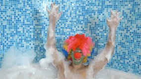 Cute clown man in the bath with copious foam. humorous concept. - Powered by Shutterstock - Get 15% off with code: PIKWIZARD15